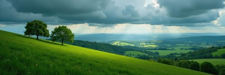 Obraz premium Rolling hills with trees against a vast plateau under a dark and cloudy sky, serene, hills, nature