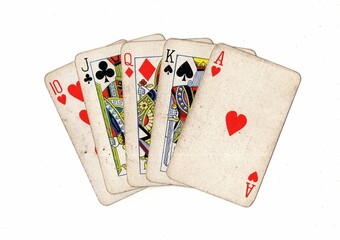 A poker hand of grubby old playing cards on a white background,.