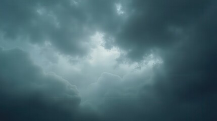 Fototapeta premium Dense gray clouds from above, pre-rain, ultra-detailed moody sky, wide and dramatic, perfect for weather or nature themes