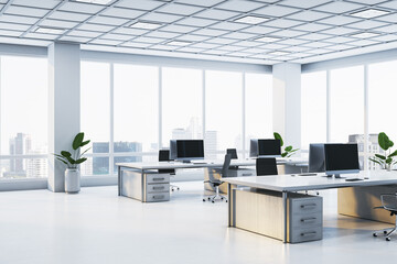 Modern office interior with desks, chairs, and computers in a spacious corporate workspace. Large windows offering a city view during daytime. 3D Rendering
