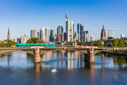 Ignatz Bubis Bridge over River Main in city against clear blue sky at Frankfurt, Germany