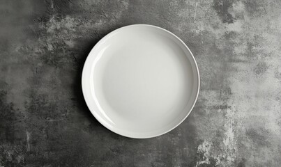 Minimalist white plate on textured gray background for modern dining presentation