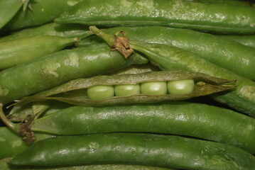 green peas on a black background