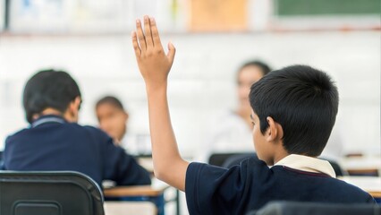 Indian Child Raising Hand in Classroom Discussion
