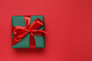 Beautiful gift box on color background 