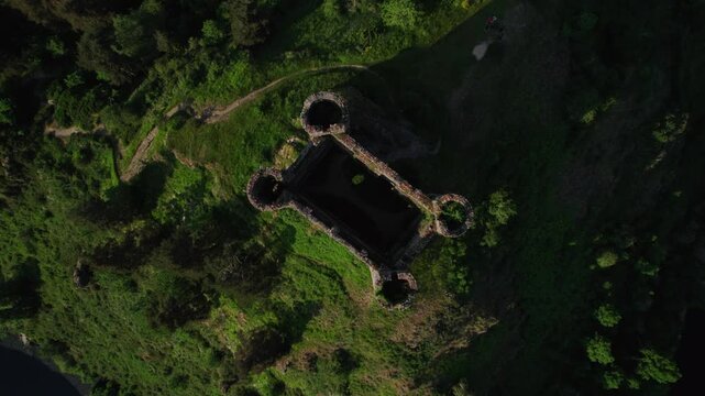 aerial top shot above Alleuze Castle at sunset, Cantal departement, auvergne rhone alpes region, france