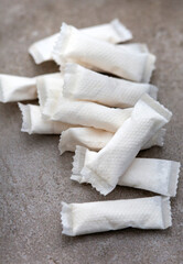 nicotine pouches on a grey surface