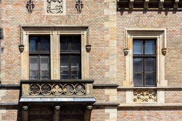 Two rectangular windows with balcony and bas-relief on an old brick building in Prague. From the series Windows of the World.