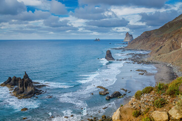 Scenic rugged coastline of Benijo Beach with dramatic rock formations and crashing waves in Tenerife