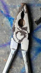 Rusty pliers with worn-out handles
