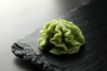 Hot wasabi paste on grey table, closeup