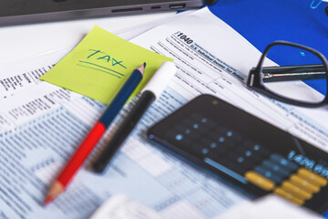 Accountant preparing tax form 1040 for tax season 2025