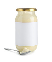 Tasty mayonnaise sauce in glass jar with blank label and spoon isolated on white