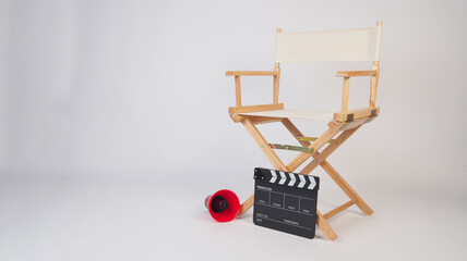 Director chair and clapperboard and megaphone on white background
