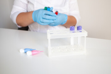 Medical laboratory nurse preparing tools for making blood tests