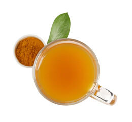 Aromatic turmeric tea in glass cup, powder and green leaf isolated on white, top view