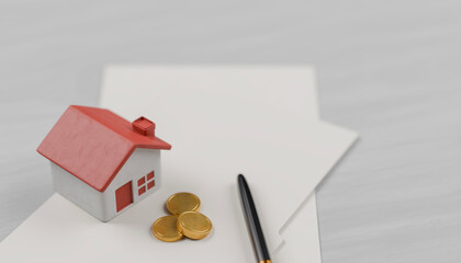 real estate concept. house, coins, pen on the table. finance or investment real estate.