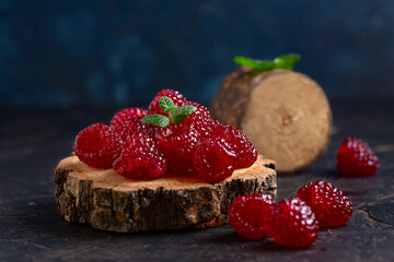 Vibrant Raspberries on Rustic Wooden Slice.