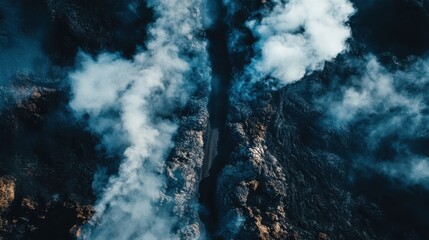 Fototapeta premium Aerial view shows a volcanic landscape with smoke and lava