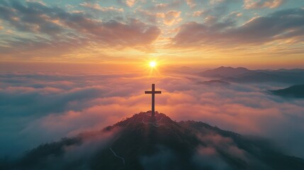 Obraz premium Cross on hill. Clouds and sun. Christian symbol. Beautiful sky. Religious faith. Hope and peace. Worship and belief. God is love.