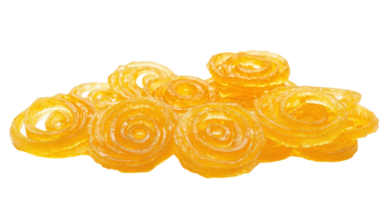 Bright yellow spiral candies displayed artistically on a clean surface in a cozy setting