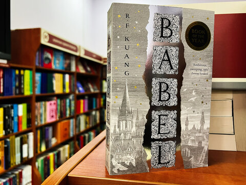 Novel 'Babel' by R.F. Kuang displayed in a bookstore surrounded by shelves