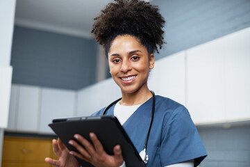Smiling Healthcare Professional Using a Digital Tablet in a Medical Office