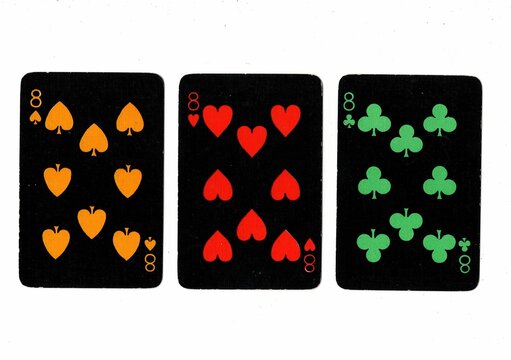 A hand of black vintage playing cards showing three of the same value.