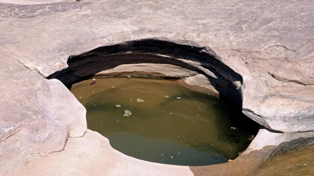 Water holes in an eroded riverbed, Sam Phan Bok, Thailand