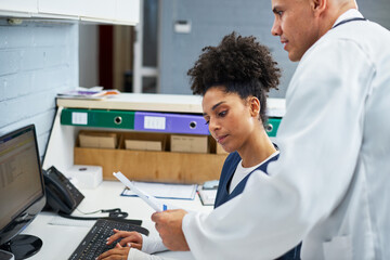 Health Administrative Staff Collaborating in Professional Office Environment
