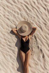 A woman in a black swimsuit lying on pristine sand with a straw hat covering her face, creating a minimalist beach scene with beautiful light and shadow play. Generative AI