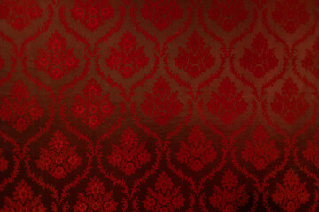 Closeup of red victorian vintage textured textile wall