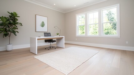 Modern home office with hardwood floors, windows, and plant