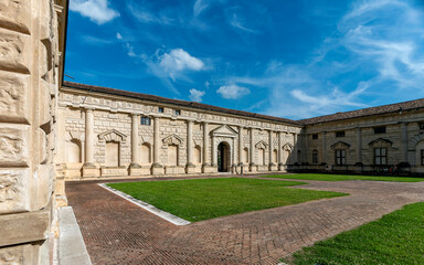 The inner courtyard of Palazzo Te, an example of Mannerist architecture, features a central loggia...