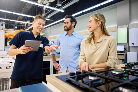 Engaging and insightful discussion taking place in a modern kitchen showroom setting