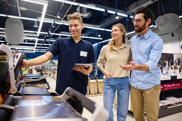 The Friendly Sales Associate is providing valuable assistance to customers in the Electronics Store