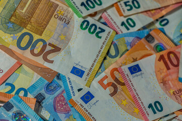 Colorful assortment of euro banknotes arranged creatively on a flat surface