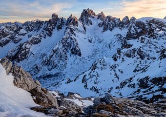Dramatic Snowy Peaks of the mountains at Sunset