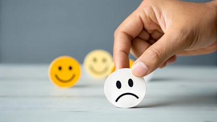 Hand Choosing Neutral Face Over Smiley and Sad Faces Emotional Expression and Decision Concept