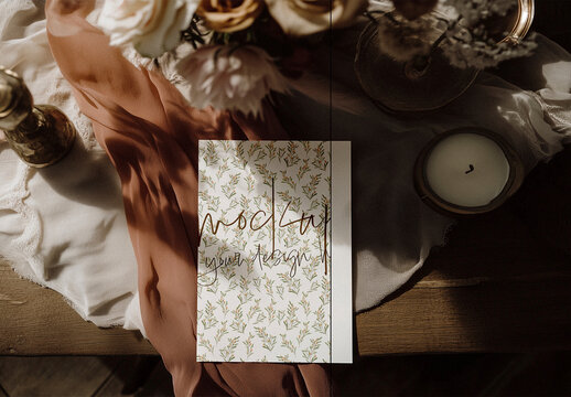 Elegant Wedding Invitation Mockup on a Rustic Table with Soft Shadows
