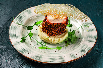 Chicken breast cooked sous vide in beetroot breading with couscous garnish and spinach sauce....