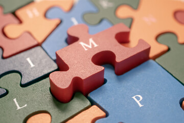 Fototapeta premium wooden colorful puzzle with letters
