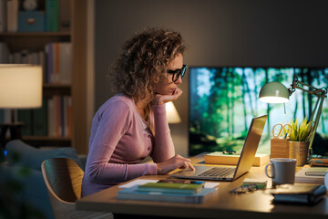 Young woman working in her home office