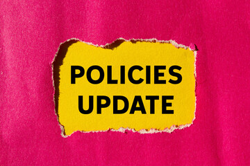 Policies update message written on ripped torn pink paper on yellow background. Conceptual policies update symbol. Copy space.