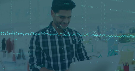 Image of financial data processing over biracial businessman in office