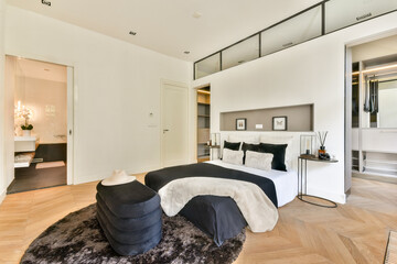 A stylishly decorated room featuring contemporary furniture, sleek lines, and a neutral color palette, creating a serene living space.