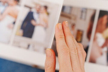 flipping through a photo book with wedding photos
