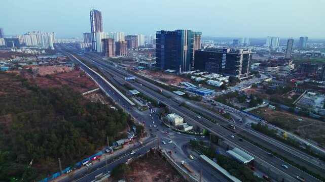 Financial District and outer ring road with Glass facade buildings and tower buildings at Nanakramguda, Hyderabad, Telangana, india. day time, push back, drone shot, 4k.