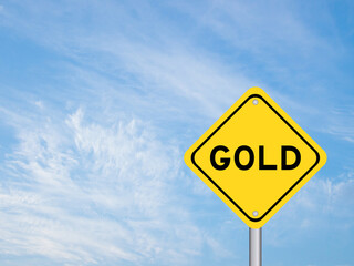 Yellow transportation sign with word gold on blue color sky background