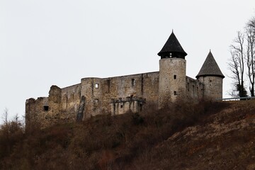 Fototapeta premium Historic stone castle with conical towers.